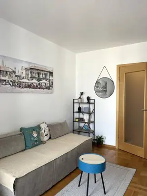 a living room with a couch and a table at Studio Pao in Podgorica