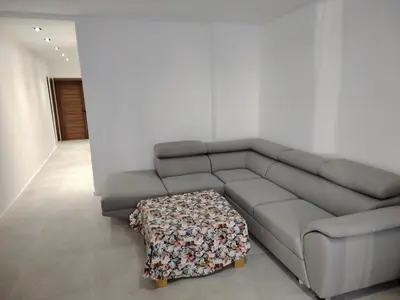 a living room with a couch and a table at Redondo Apartments Budva in Budva