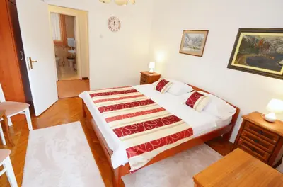 a bedroom with a large bed in a room at Central Art Oasis Kotor in Kotor