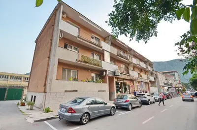 a group of cars parked in front of a building at Central Art Oasis Kotor in Kotor