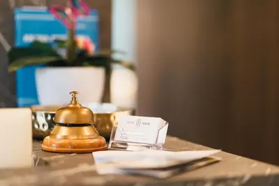 a tea kettle sitting on top of a table at Hotel Teuta in Ulcinj