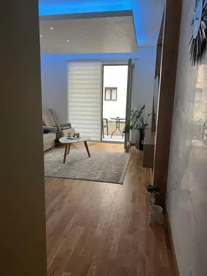 a living room with a couch and a table at Apartman Jakov in Becici