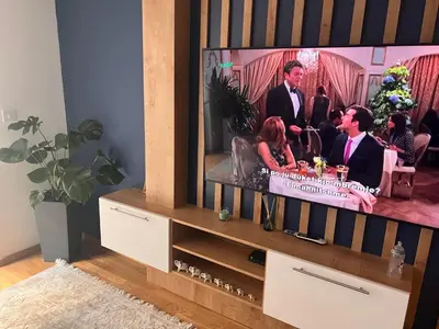 a flat screen tv sitting on top of a entertainment center at Apartman Jakov in Becici