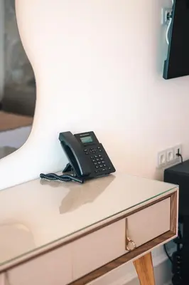 a black phone sitting on top of a desk at Miramar in Ulcinj