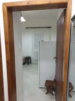 a kitchen with a white refrigerator in a room at Warm & Welcoming Vele Residence in Bar