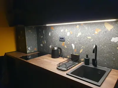 a kitchen with a sink and a counter top at Studio apartman Luka in Cetinje