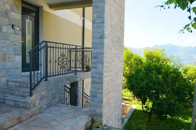 a house with a balcony with a view at Radgost Kotor Apartments in Kotor