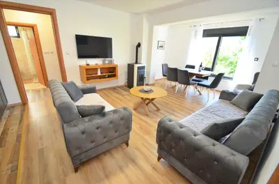 a living room with two couches and a table at Radgost Kotor Apartments in Kotor