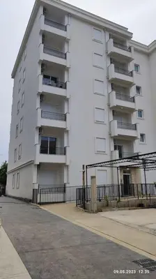 a large white building with balconies on the side of it at Apartments LORA Susanj #39 in Bar