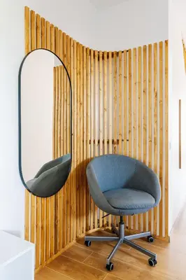 a room with a chair and a mirror at 2-floor penthouse with stunning views in Budva
