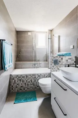 a bathroom with a tub and a toilet and a sink at 2-floor penthouse with stunning views in Budva