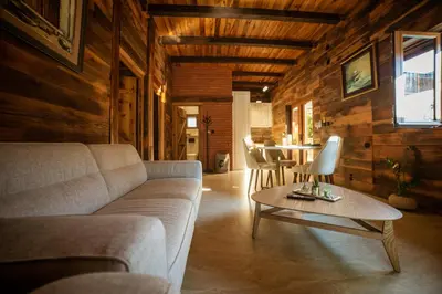 a living room with a couch and a table at Carevic Resort & Villas in Budva