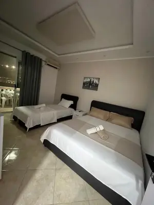 a hotel room with two beds in a room at Keon in Ulcinj