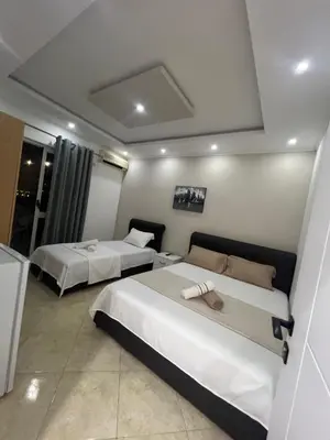 a hotel room with two beds in a room at Keon in Ulcinj