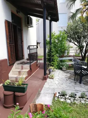 a patio with a bunch of potted plants at Apartments Sandra in Kotor