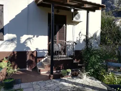 a porch of a house with a balcony at Apartments Sandra in Kotor