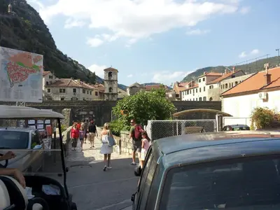 a group of people walking down a street at Apartments Sandra in Kotor