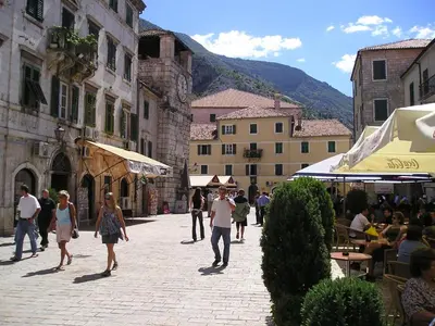 a group of people walking down a street at Apartments Sandra in Kotor
