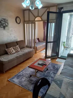 a living room with a couch and a table at STELLA di mare in Sutomore