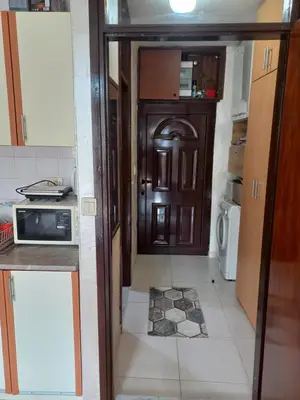 a kitchen with a wooden door in a room at STELLA di mare in Sutomore