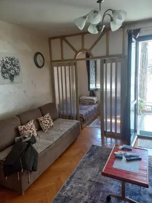 a living room with a couch and a table at STELLA di mare in Sutomore