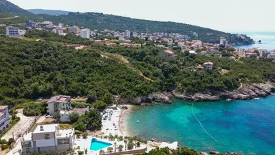 an aerial view of a beach and the ocean at Bungalovi Arabela in Utjeha