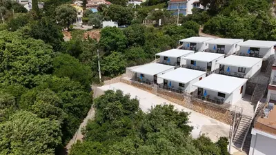 an aerial view of a house with white roofs at Bungalovi Arabela in Utjeha