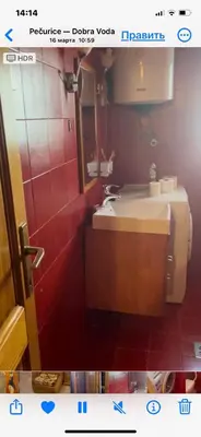 a bathroom with a sink and a mirror at Семейный комплекс для отдыха in Pečurice