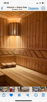 a bench in a sauna with a light above it at Семейный комплекс для отдыха in Pečurice
