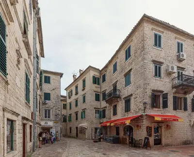 a street in an old town with buildings at Apartman Maestral in Kotor