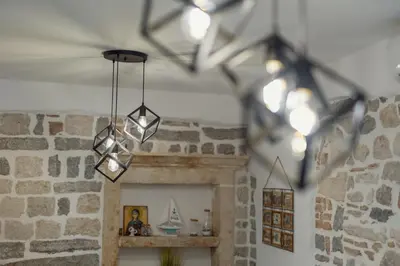 a group of lights hanging from a ceiling at Apartman Maestral in Kotor