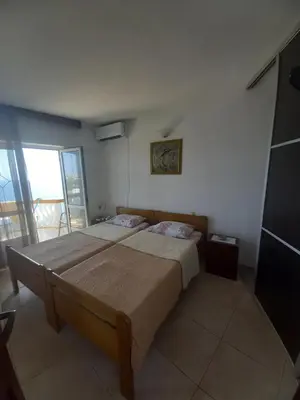 a bedroom with a large bed in a room at Apartments & Rooms Villa Anastasija in Ulcinj