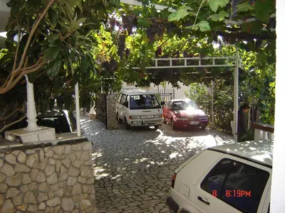 a group of cars parked in a parking lot at Apartments & Rooms Villa Anastasija in Ulcinj