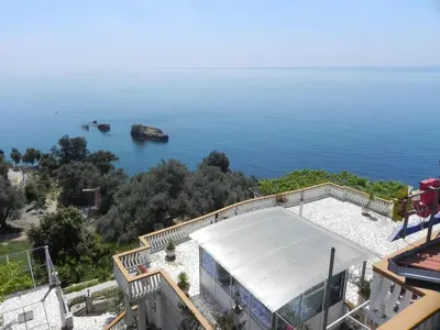 a house with a view of the water at Apartments & Rooms Villa Anastasija in Ulcinj