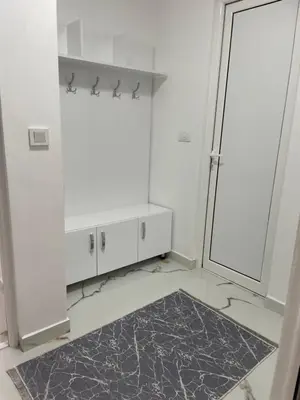 a white bathroom with a shower and a mirror at Villa Draga in Ulcinj
