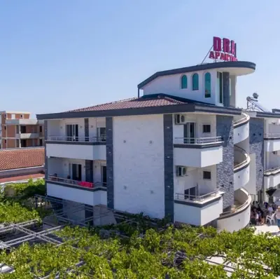 a building with a clock tower on top of it at Villa Draga in Ulcinj