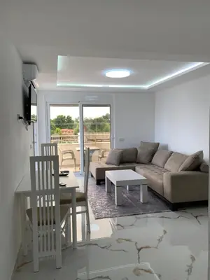 a living room with a couch and a table at Villa Draga in Ulcinj