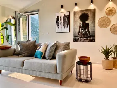a living room with a couch and a picture on the wall at The View apartment 2 in Petrovac na Moru