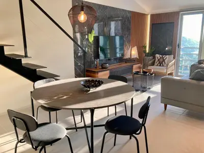 a living room with a table and chairs at The View apartment 2 in Petrovac na Moru