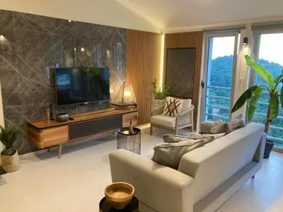 a living room with a couch and a flat screen tv at The View apartment 2 in Petrovac na Moru