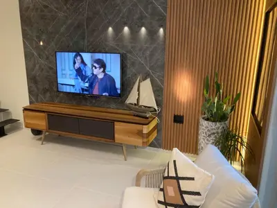 a living room with a flat screen tv on a table at The View apartment 2 in Petrovac na Moru