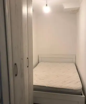 a small room with a small bed in it at Stan Budva - Potkosljun in Budva