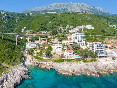 an aerial view of a town on a rocky coast at Apartments BABKO in Bar