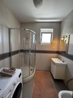 a bathroom with a shower and a sink at Apartments BABKO in Bar