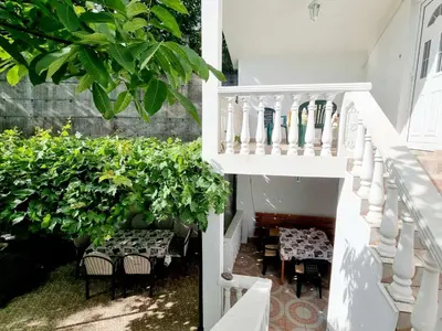 a staircase leading up to a house with green plants at Cozy House Haj Nehaj in Sutomore