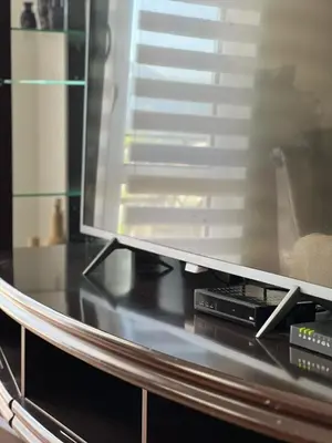 a flat screen tv sitting on top of a table at Villa Bubanja with shared pool in Kotor