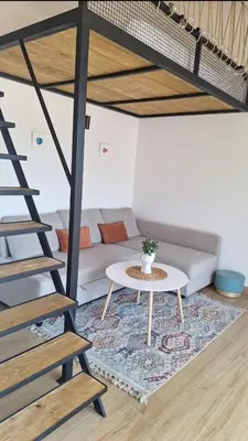 a living room with a couch and a table at Aloft Apartment in Budva