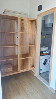a room with a closet with a washing machine at Aloft Apartment in Budva