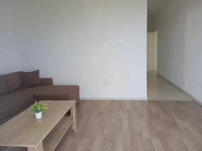 a living room with a couch and a coffee table at Apartments Verona in Ulcinj