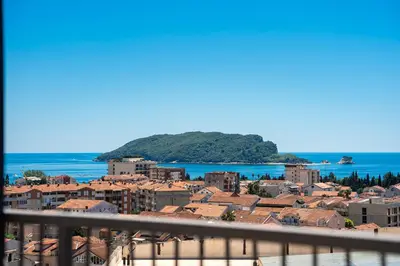 a view of a city from a balcony at Rooftop Apartments & Rooms in Budva